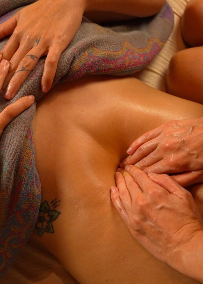 Bliss performing Mayan abdominal-womb massage