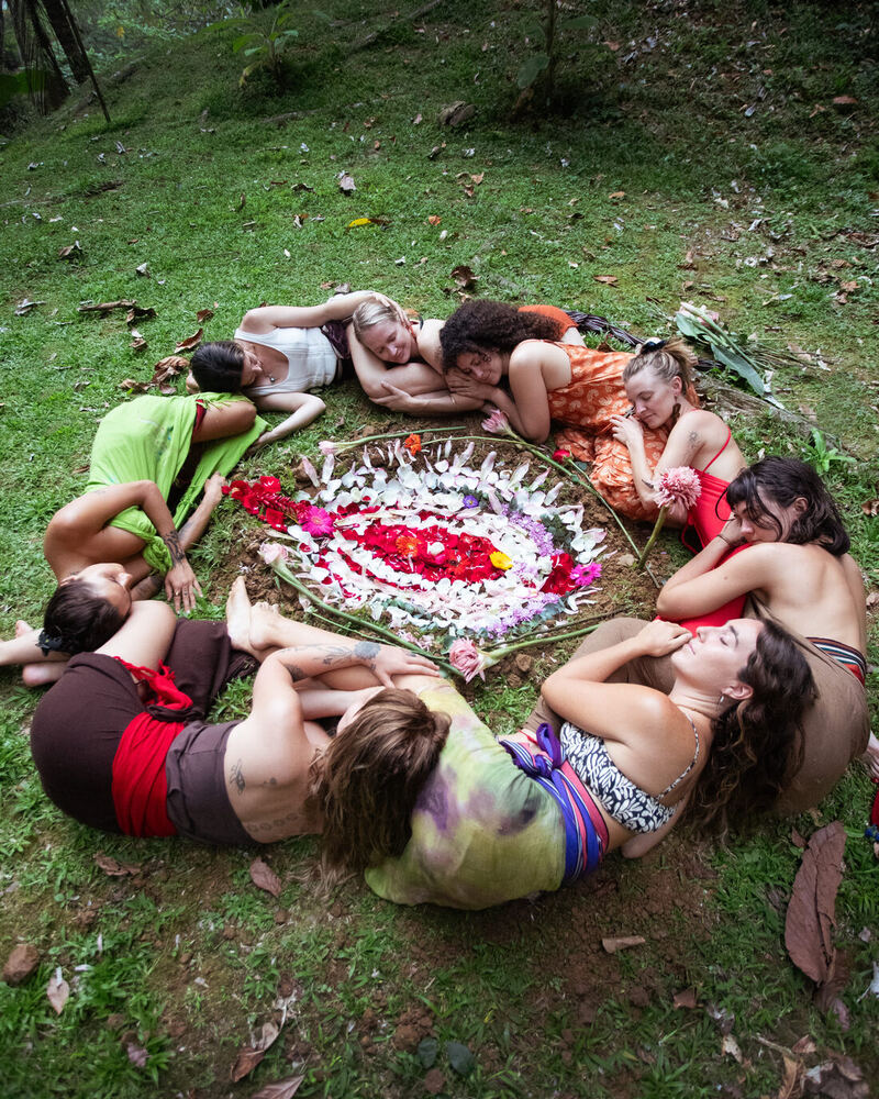 Retreat memory: circle of women with a flower mandala